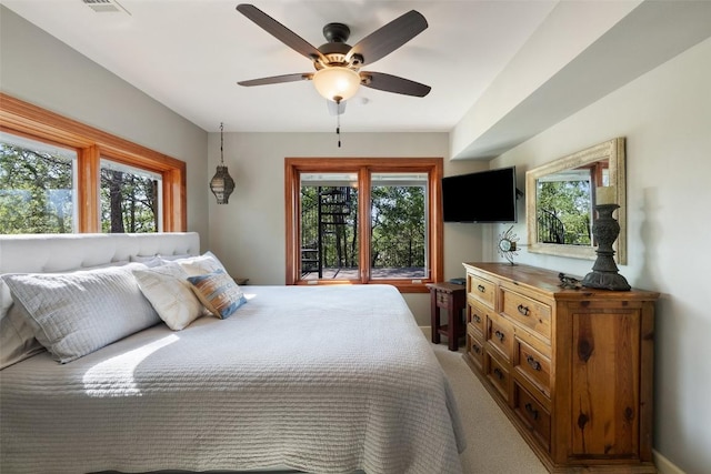 bedroom with baseboards and multiple windows