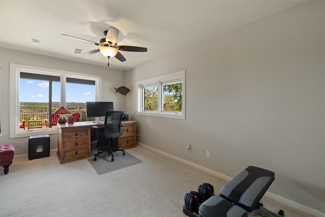 home office featuring baseboards, visible vents, ceiling fan, and carpet flooring