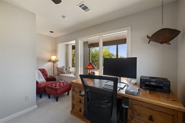 office with light colored carpet, visible vents, and baseboards