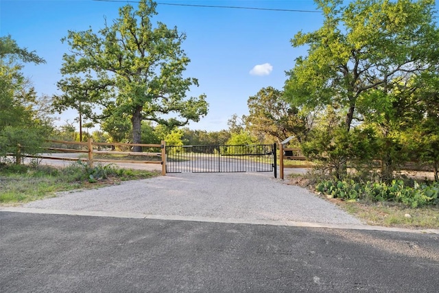 view of gate with fence