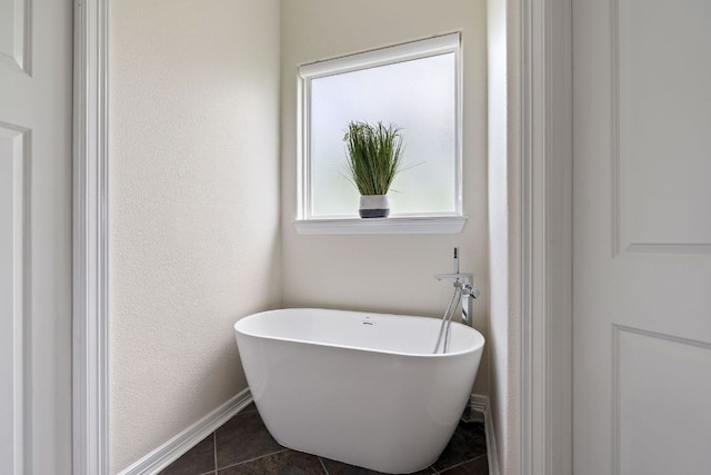 3207 Crystal Falls Pkwy, Leander, TX 78641 - full bathroom with baseboards, a freestanding bath, and tile patterned flooring