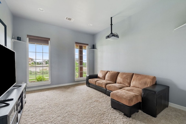3207 Crystal Falls Pkwy, Leander, TX 78641 - living area featuring a healthy amount of sunlight, baseboards, carpet flooring, and visible vents