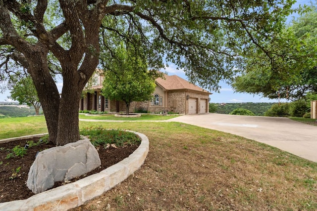 3207 Crystal Falls Pkwy, Leander, TX 78641 - view of front of home featuring brick siding, an attached garage, a front yard, and concrete driveway