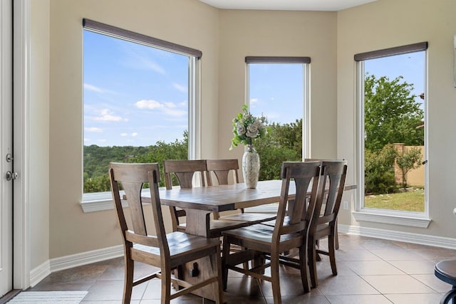 3207 Crystal Falls Pkwy, Leander, TX 78641 - dining space with baseboards and tile patterned flooring