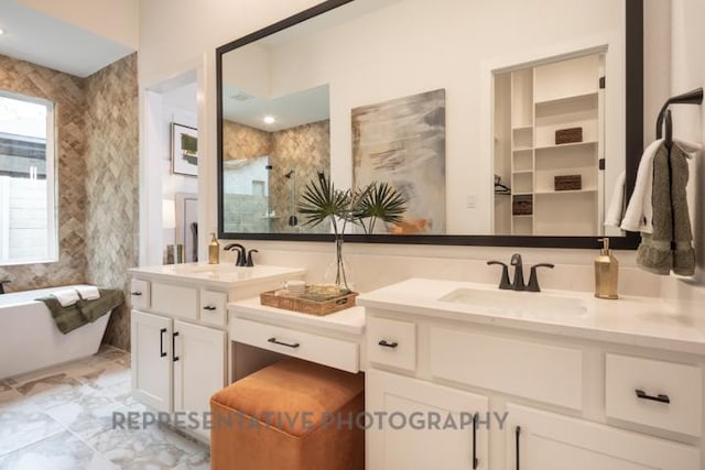 321 Dycus Bnd, Liberty Hill, TX 78642 - bathroom featuring double vanity and a freestanding bath