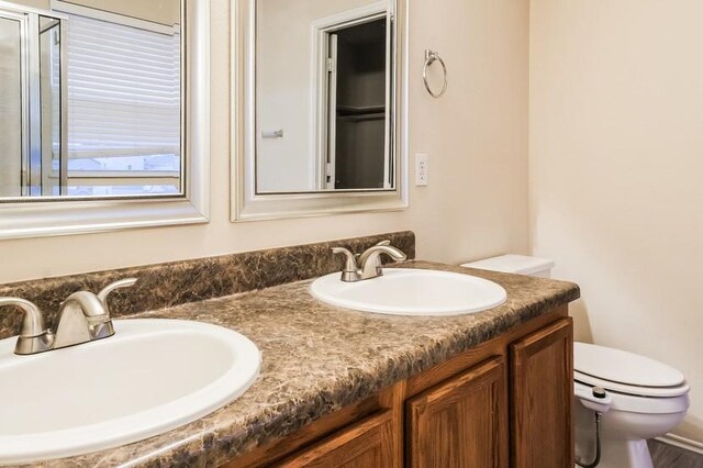 17928 Honey Locust Ln, Elgin, TX 78621 - bathroom featuring toilet and double vanity