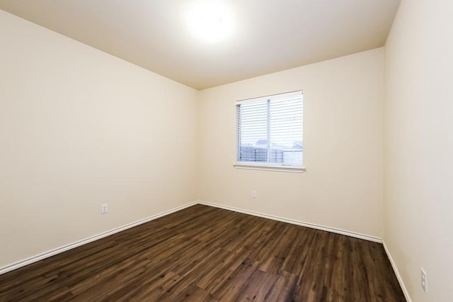 17928 Honey Locust Ln, Elgin, TX 78621 - spare room with dark wood-style floors and baseboards