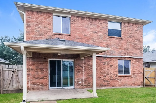 17928 Honey Locust Ln, Elgin, TX 78621 - back of property with a patio area, brick siding, and a gate