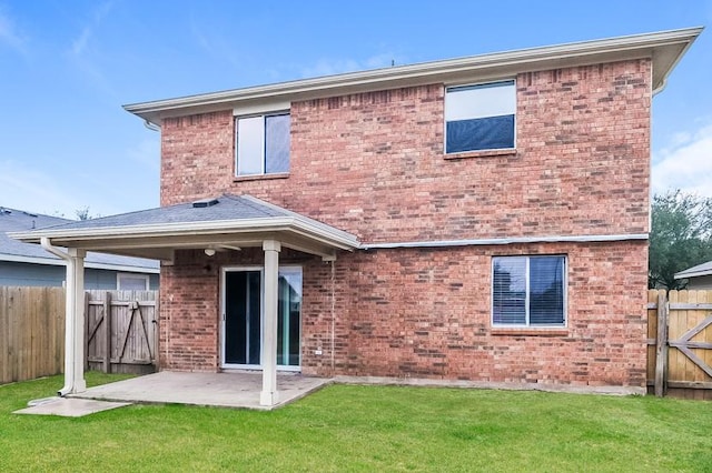 17928 Honey Locust Ln, Elgin, TX 78621 - rear view of house with a patio, brick siding, and a gate