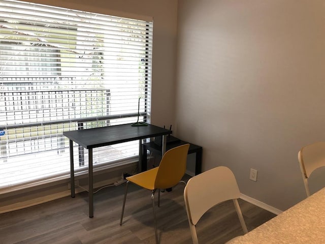2815 Rio Grande St Unit 201, Austin, TX 78705 - dining room featuring baseboards and wood finished floors