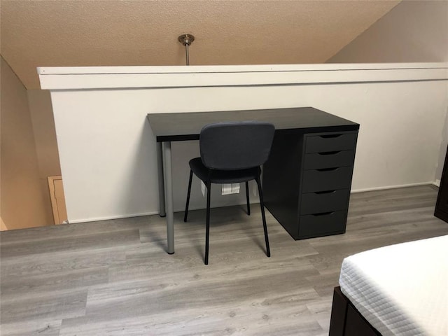 2815 Rio Grande St Unit 201, Austin, TX 78705 - bedroom featuring a textured ceiling and wood finished floors