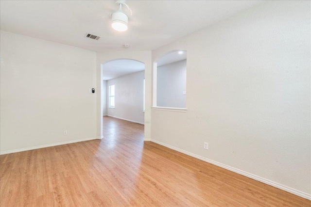 109 David Dr, Hutto, TX 78634 - unfurnished room with arched walkways and light wood-style floors