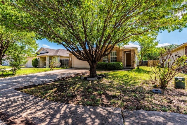 109 David Dr, Hutto, TX 78634 - view of front of home featuring driveway, a garage, and brick siding