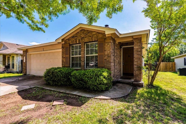 109 David Dr, Hutto, TX 78634 - ranch-style home with a front yard, central air condition unit, concrete driveway, an attached garage, and fence