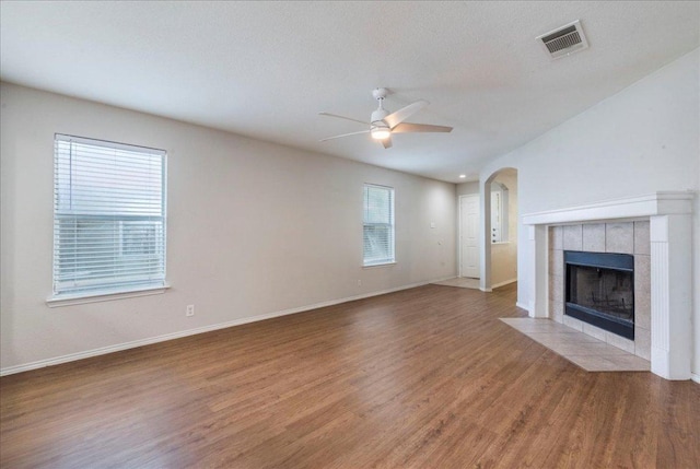 109 David Dr, Hutto, TX 78634 - unfurnished living room featuring baseboards, visible vents, wood finished floors, and a ceiling fan