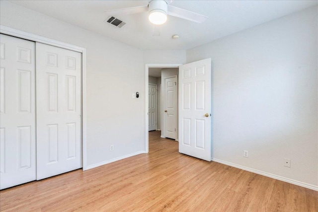 109 David Dr, Hutto, TX 78634 - unfurnished bedroom with light wood-style flooring, a closet, and a ceiling fan