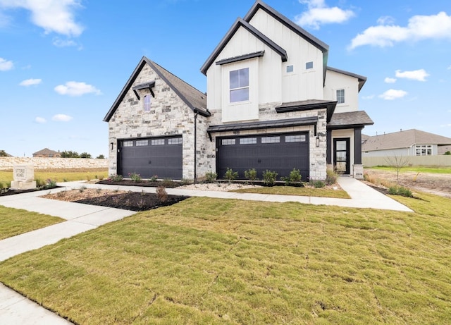 109 Flora Springs Cv, Liberty Hill, TX 78642 - view of front facade with a garage, board and batten siding, a front lawn, and stone siding