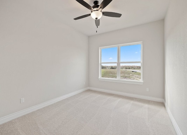 109 Flora Springs Cv, Liberty Hill, TX 78642 - spare room with light colored carpet, ceiling fan, and baseboards