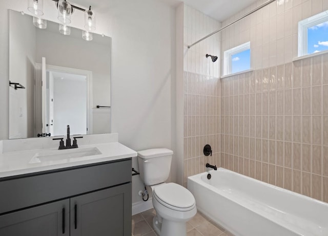 109 Flora Springs Cv, Liberty Hill, TX 78642 - full bathroom featuring toilet, vanity, washtub / shower combination, and tile patterned flooring