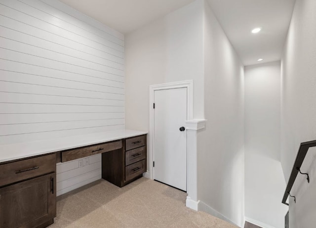109 Flora Springs Cv, Liberty Hill, TX 78642 - unfurnished office with light carpet, built in study area, recessed lighting, and baseboards