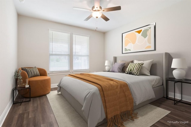 bedroom with a ceiling fan, baseboards, and wood finished floors