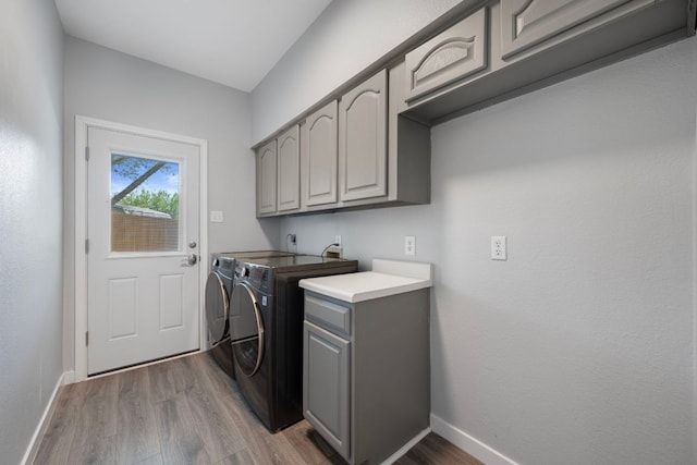 3322 Silk Oak Dr, Austin, TX 78748 - washroom with cabinet space, washer and dryer, baseboards, and wood finished floors