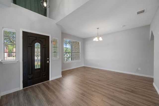 3322 Silk Oak Dr, Austin, TX 78748 - foyer entrance featuring a chandelier, wood finished floors, and baseboards