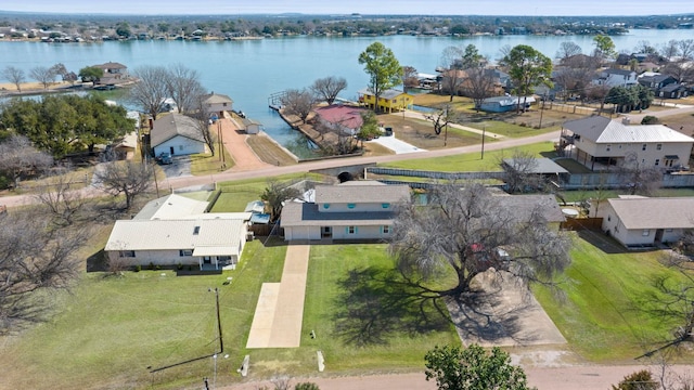 birds eye view of property with a water view and a residential view