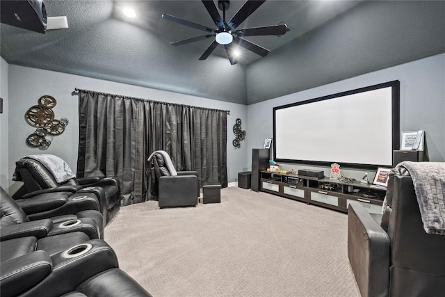 carpeted home theater room featuring ceiling fan and lofted ceiling