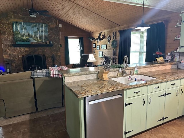 kitchen featuring dishwasher, a fireplace, a sink, a ceiling fan, and open floor plan