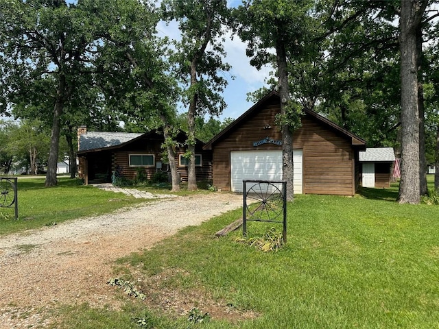 view of outbuilding with dirt driveway