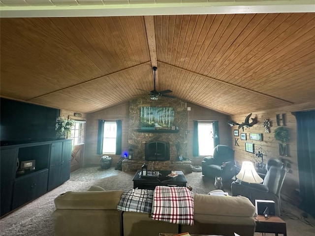 carpeted living area featuring ceiling fan, plenty of natural light, and wooden ceiling