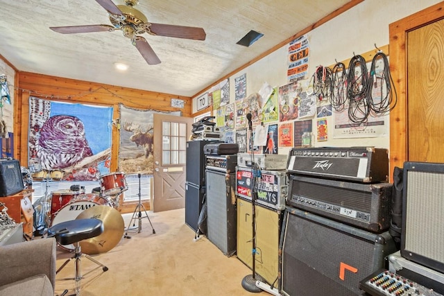 interior space featuring carpet and a ceiling fan