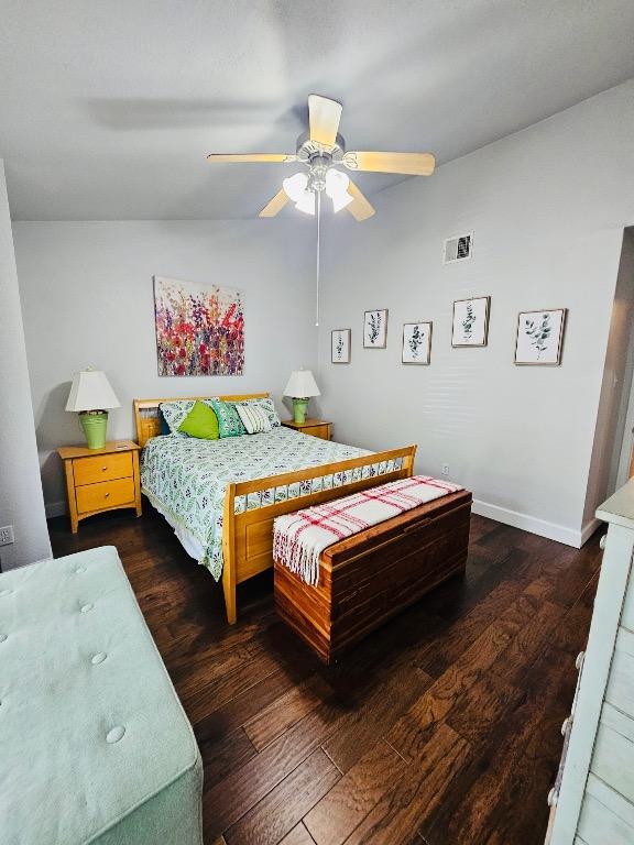 5107 Leralynn St Unit 304, Austin, TX 78751 - bedroom featuring hardwood / wood-style floors, baseboards, a ceiling fan, and lofted ceiling