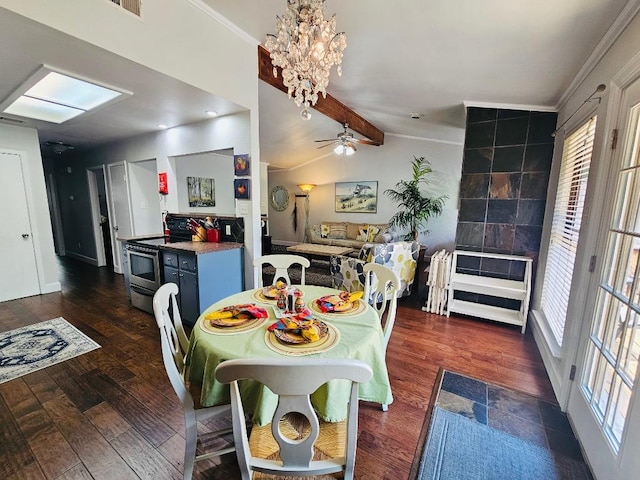 dining space with lofted ceiling with beams, ceiling fan with notable chandelier, ornamental molding, and dark wood-style flooring