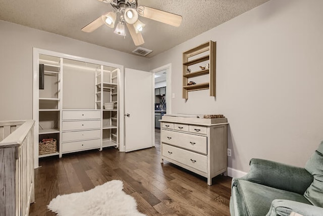 5107 Leralynn St Unit 304, Austin, TX 78751 - living area featuring ceiling fan, dark wood-type flooring, and a textured ceiling