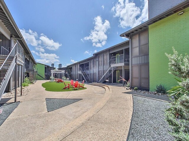 909 Reinli St Unit 241, Austin, TX 78751 - view of concrete driveway with stairs