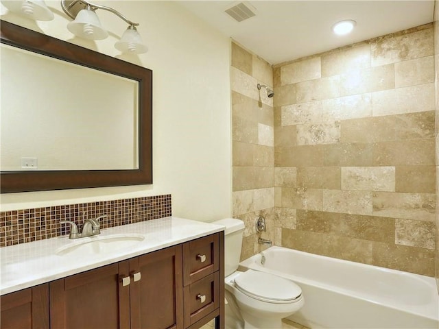 909 Reinli St Unit 241, Austin, TX 78751 - bathroom with vanity, tasteful backsplash, shower / bath combination, and toilet