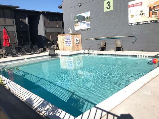 community pool featuring fence