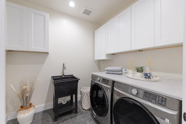 washroom with recessed lighting, cabinet space, independent washer and dryer, visible vents, and baseboards