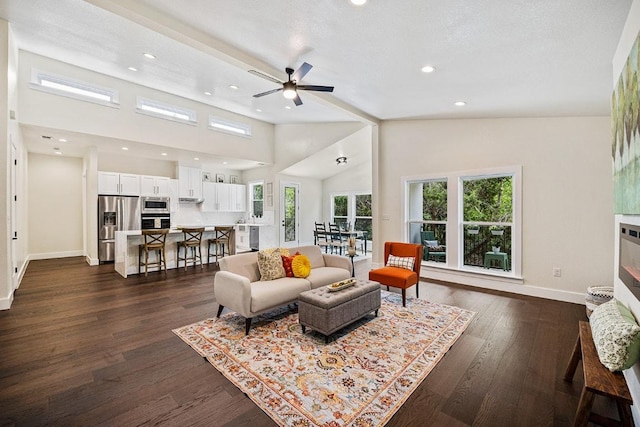 living room with recessed lighting, plenty of natural light, dark wood-style floors, and baseboards