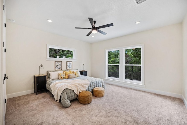 carpeted bedroom featuring visible vents, recessed lighting, a ceiling fan, and baseboards