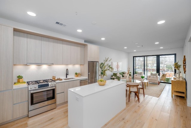 2209 S 1st St Unit 313, Austin, TX 78704 - kitchen featuring stainless steel appliances, modern cabinets, a center island, and recessed lighting