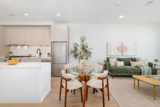 2209 S 1st St Unit 313, Austin, TX 78704 - dining room with light wood-type flooring and recessed lighting