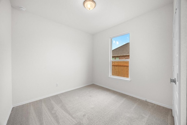 121 Coastal Way, Georgetown, TX 78628 - empty room featuring carpet flooring, a smoke detector, and baseboards