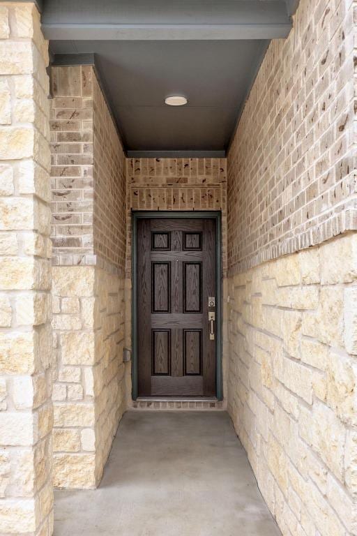 121 Coastal Way, Georgetown, TX 78628 - entrance to property featuring brick siding and stone siding