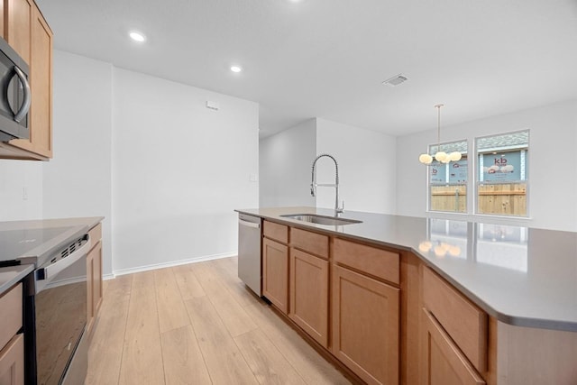 109 Coastal Way, Georgetown, TX 78628 - kitchen featuring a sink, dishwasher, electric range oven, light wood finished floors, and light countertops