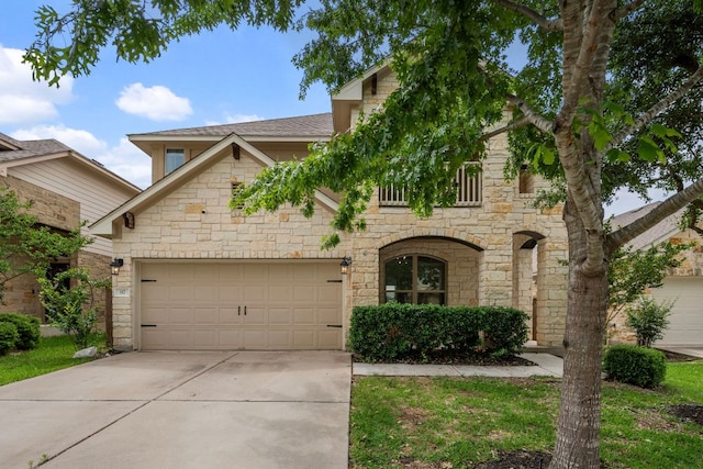 117 Rock Mill Loop, Georgetown, TX 78626 - view of front of home with stone siding, driveway, and a garage