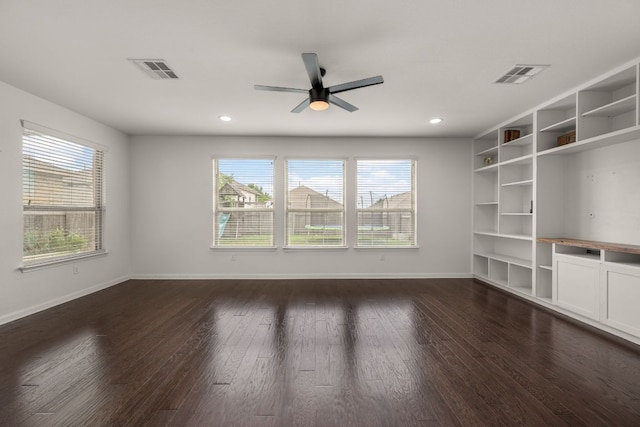 117 Rock Mill Loop, Georgetown, TX 78626 - unfurnished living room with dark wood-style flooring, baseboards, ceiling fan, and recessed lighting