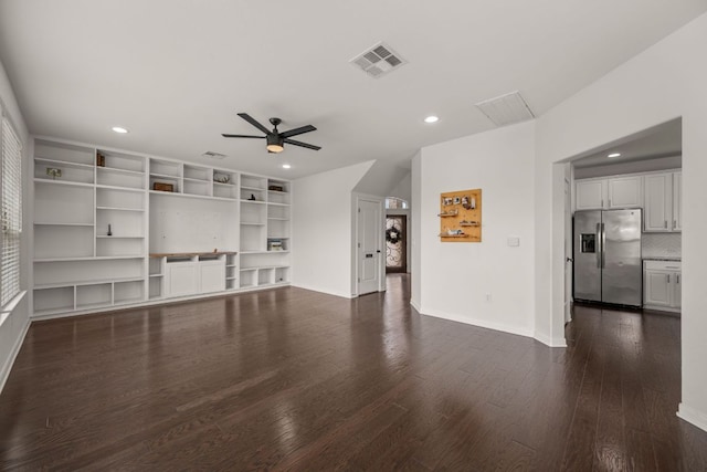 unfurnished living room with dark wood-style flooring, a ceiling fan, visible vents, and recessed lighting